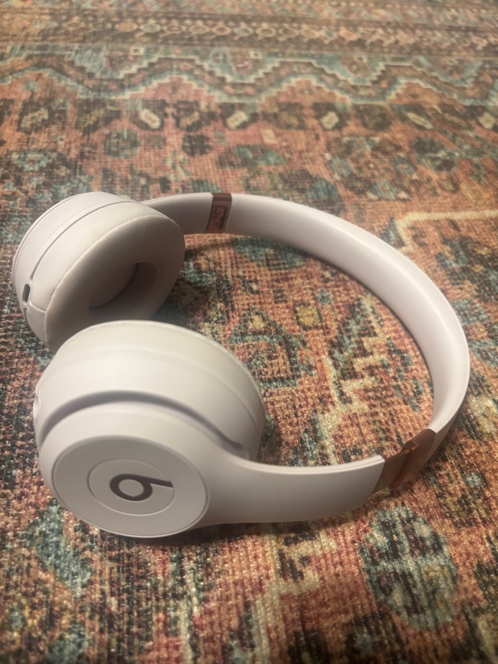 Beats Solo 4 Wireless Over-Ear Headphones in Light Gray with Rose Gold Accents. - Picture 3 of 8